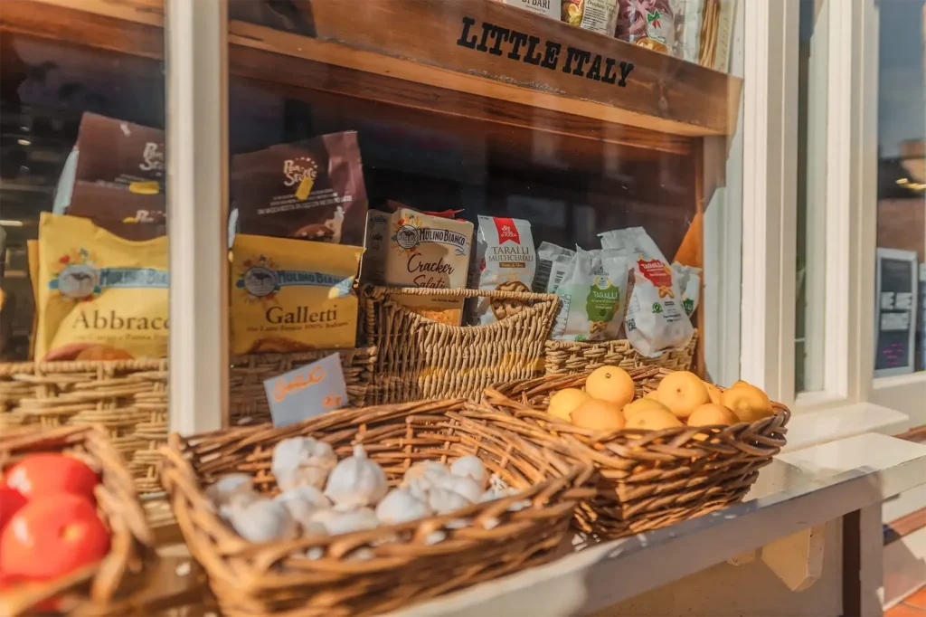 Traditional Italian deli display with imported Italian groceries and fresh produce at Little Italy York