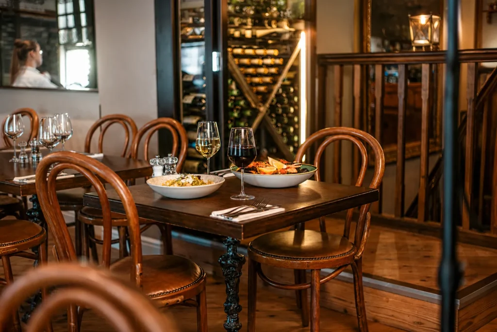 Table set with homemade pasta, seafood dishes and Italian wines at Little Italy restaurant in York