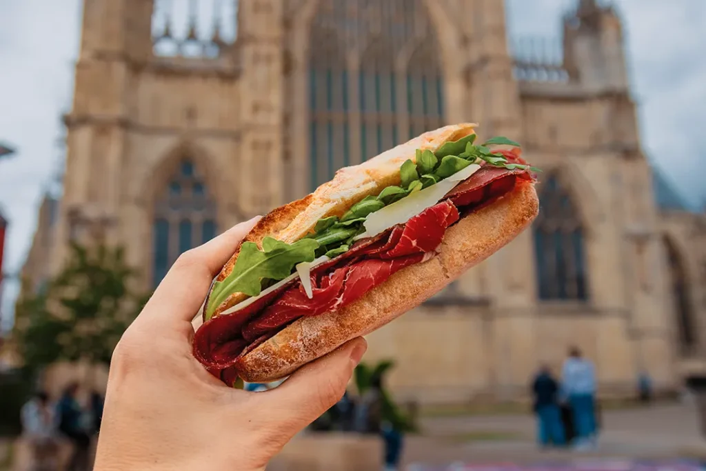 Authentic Italian sandwich with cured meat, Parmesan and rocket in front of York Minster