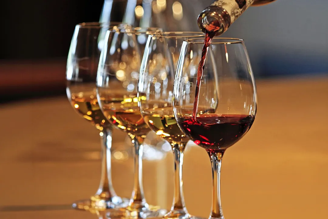 Dessert wine being poured into tasting glasses at Little Italy in York