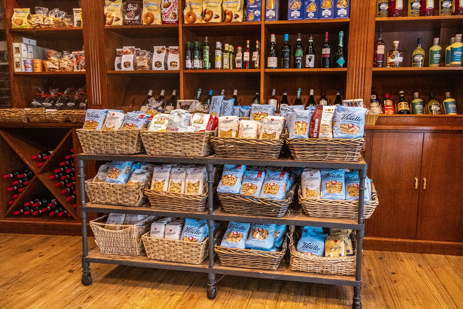 Shelves of authentic Italian pasta, wines and speciality delicatessen products inside Little Italy York