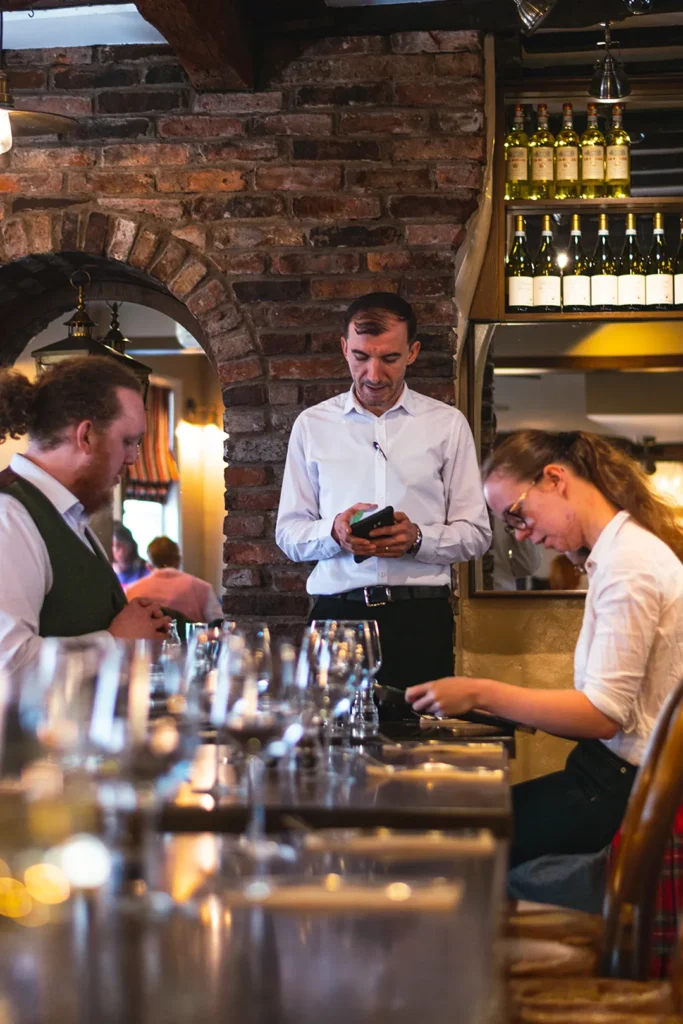 Little Italy staff providing friendly table service inside the restaurant in York
