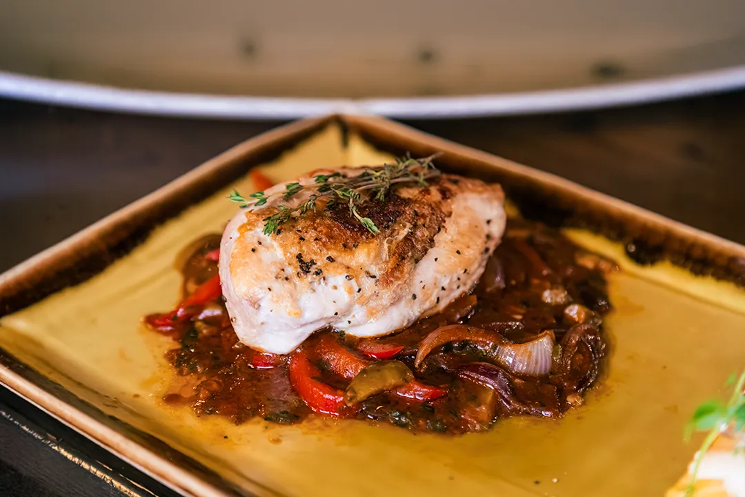 Pan roasted chicken breast served with Mediterranean tomato and vegetable sauce at Little Italy in York