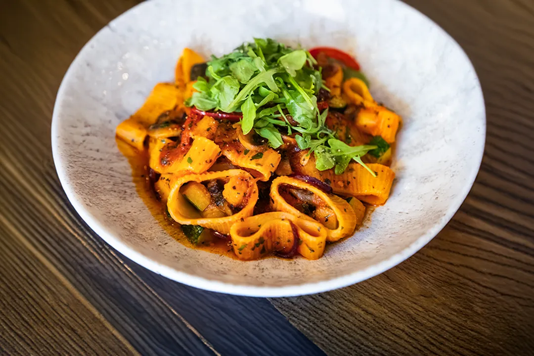 Rigatoni pasta with Mediterranean vegetables, tomato sauce and fresh rocket at Little Italy in York