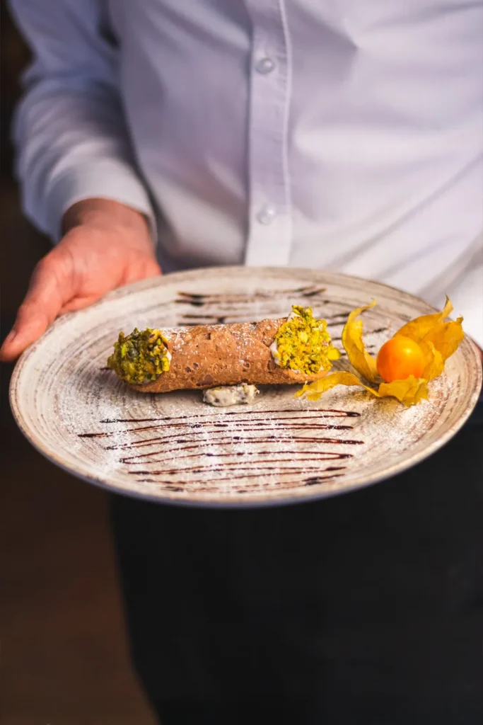 Traditional Sicilian cannoli with pistachios served at Little Italy restaurant in York